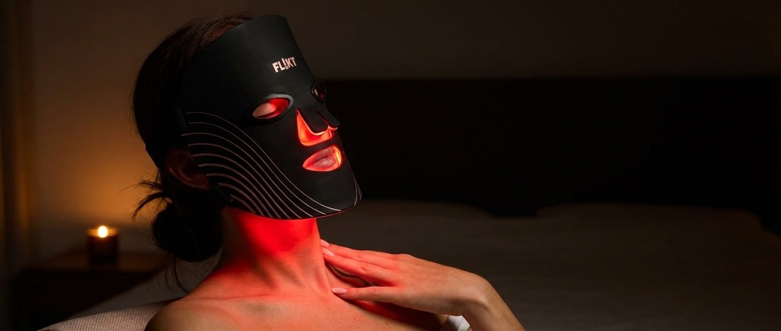 Woman wearing LED silicone face mask